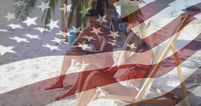 Man pointing, woman adjusting shades and turning, beach, faint US flag overlay for travel