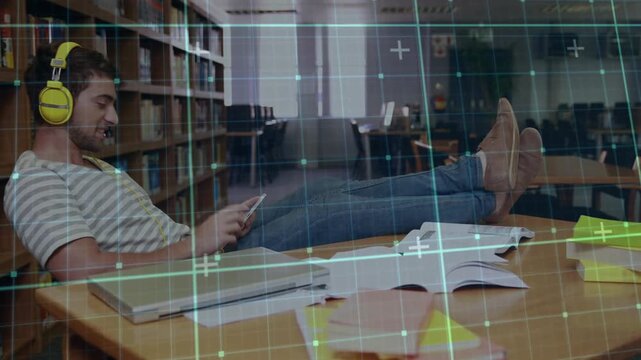 Male student lounging at campus table, pulling phone, tapping, digital grid marking notes education