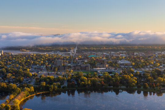 A Scenic View Of A Town Along The Mississippi River with Fog Clouds On The Horizon