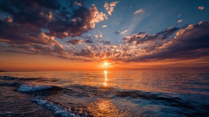 Ocean sunset Sun breaking through clouds, casting rays over calm water. Sky ablaze