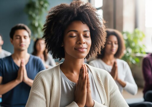 Serene african american woman practicing yoga in a group meditation - Powered by Adobe