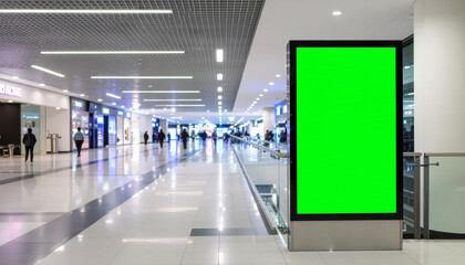 Showcase your brand with a vibrant green screen display in a modern shopping mall, ideal for advertising, marketing campaigns, and eye-catching promotions
