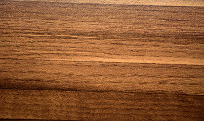 Dark walnut, striped natural wood grain close-up.