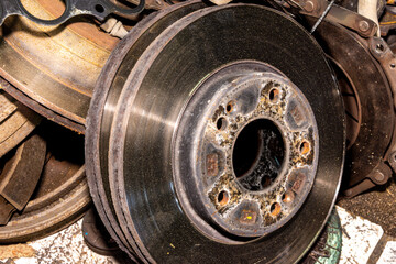 Old brake parts dumped after repair - rusty discs drums and chewed-up pads