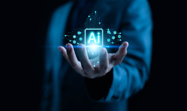 A business professional holding a glowing AI chip hologram, symbolizing artificial intelligence, digital innovation, advanced technology, and the power of data-driven solutions in modern business.