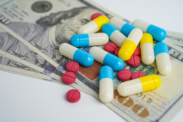 Pills on money dollars, Medicine prescription drugs cost concept, healthcare expenses
