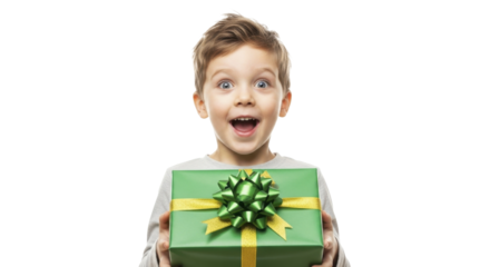 Young excited boy holding wrapped Christmas gift on a transparent background PNG image