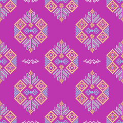 Ethnic boho ornament design on a pink background. Pixel seamless pattern. Vector illustration for web design or print. Cross-stitch design vector for textiles, wallpaper, rugs, and fabrics on print.