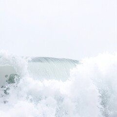 A skilled surfer expertly rides a powerful wave, showcasing dynamic balance and agility against a backdrop of sparkling blue ocean water.