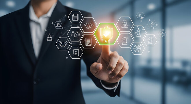 Businessman touching a digital shield icon representing cybersecurity and data protection for business technology solutions