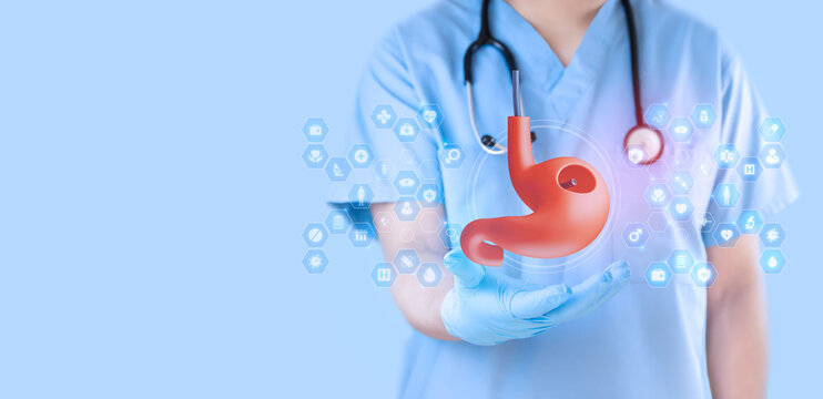 Gastroenterologist reviewing a digital image obtained via endoscopy of the stomach against a clean, light blue background. Gastrointestinal analysis and medical evaluation.