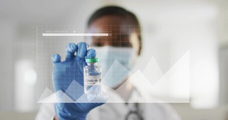 Showing nurse holding COVID-19 vial in clinic, wearing mask blue gloves lab coat stethoscope, grid