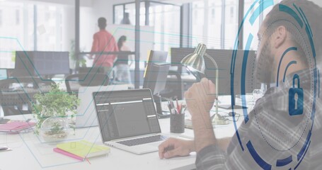 Sitting bearded man in plaid shirt coding on laptop at office, with security overlay, copy space