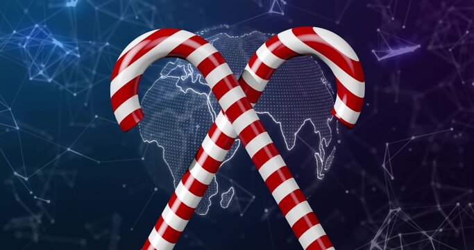 Naklejki Displaying two glossy candy canes crossing in digital artwork, with dotted globe and network lines