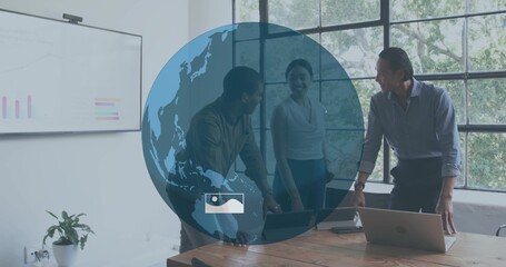 Leaning coworkers in business casual collaborating around wooden meeting table with globe overlay