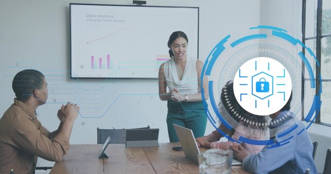 Presenting woman in white top gesturing and explaining charts in meeting room with AR lock overlay