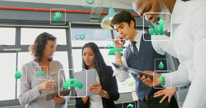 Discussing four team staff in business attire using tablets and phone at office with green overlays