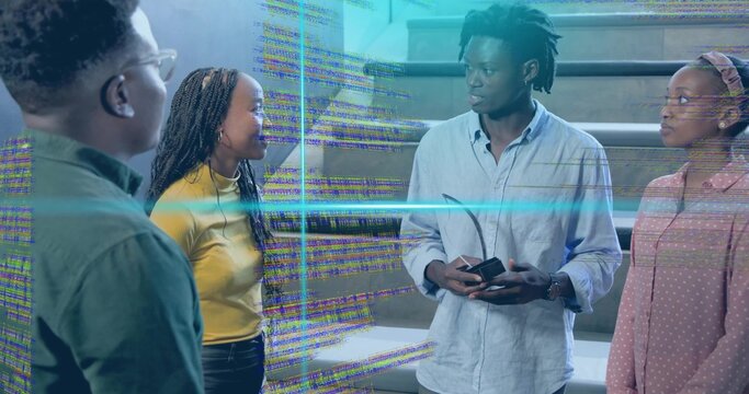 Discussing holographic code overlay on steps, four peers with man in blue shirt holding phone