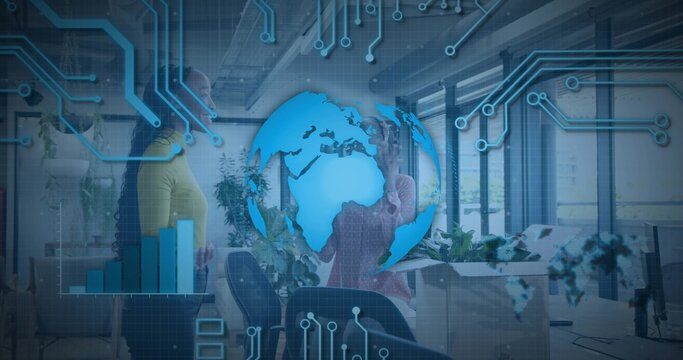 Gesturing team members in business casual presenting data in open-plan office, with blue data globe - Powered by Adobe