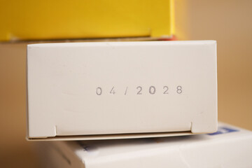 Expiration date on medicine packaging observed in close-up shot