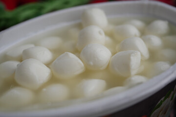Soft cheese balls in brine ready for serving