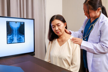 Senior woman receiving a neck examination from an orthopedic specialist in a hospital setting, highlighting clinical evaluation, pain diagnosis, and professional medical care for aging patients