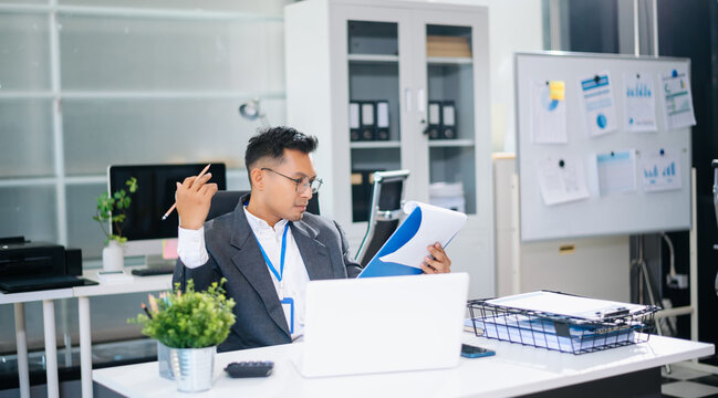 Mature business man executive manager looking at laptop watching online webinar training or having virtual meeting video conference doing market research - Powered by Adobe