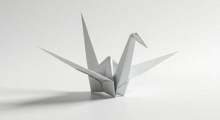 Single pristine white origami crane beautifully illuminated creating subtle shadows on a clean bright background. AI Generated