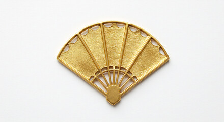 Shiny gold art deco fan charm reflects soft studio light against a clean white backdrop emphasizing its texture. AI Generated