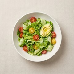 Fresh Avocado Salad with Cherry Tomatoes and Romaine Lettuce on White Plate and white background Flat Lay