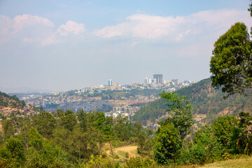View through valley of urban skyline of African city