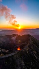 Naklejka premium Aerial view of volcanic crater at sunrise with erupting lava