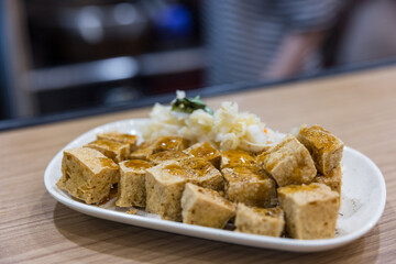 Traditional fried stinky tofu served with pickled cabbage