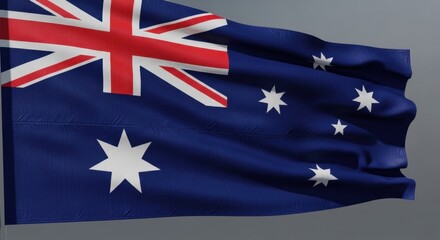 Waving flag of australia featuring the union jack and the commonwealth star emblem.