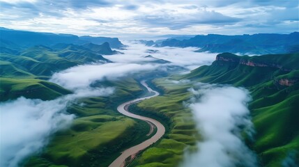 Aerial View of Serene River Flowing Through Lush Green Valleys under Dramatic Cloudy Sky

