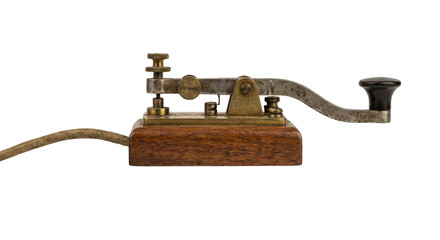 Vintage morse code telegraph key, an old historical communication device on isolated background.