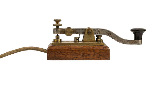 Vintage morse code telegraph key, an old historical communication device on isolated background.