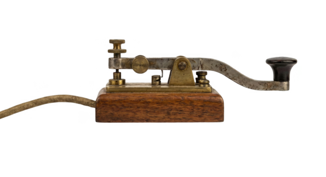 Vintage morse code telegraph key, an old historical communication device on isolated background.