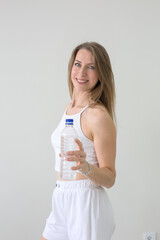 Smiling Woman Offering a Water Bottle for Hydration