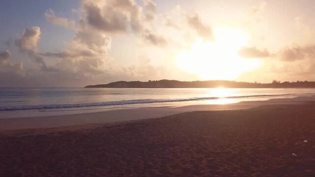 4k 30 fps sunrise in the caribbean beach in the mornig with drone