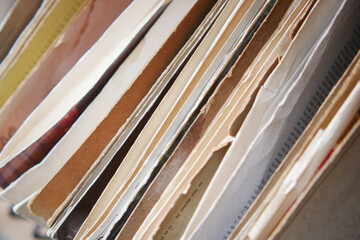 Old documents stacked in a disorganized manner