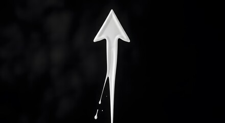 Fototapeta premium Abstract white liquid arrow shape dripping downwards symbolizing movement growth and purity against deep dark black empty background studio shot
