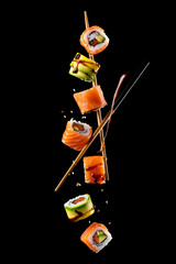 Sushi food rolls with fish, shrimp with chopsticks