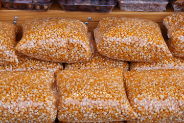 Yellow corn kernels packaged for sale at local market