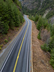 Winding Mountain Road Through Dense Forest in BC, Canada Landscape