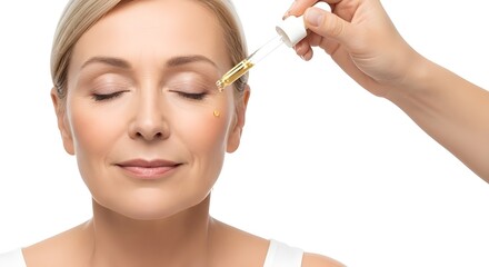 Mature woman applying facial oil serum with dropper for anti-aging skincare isolated on white.