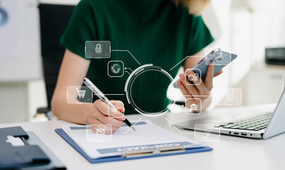 Businesswoman hand working digital marketing media in virtual screen with mobile phone and modern compute with virtual icon diagram