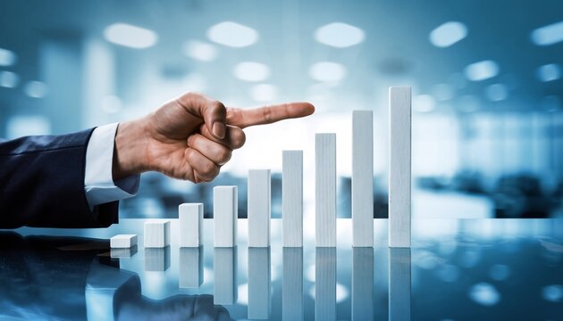 Businessman's hand pointing at a growing bar graph in a modern office, concept for financial success, business strategy and market analysis. - Powered by Adobe