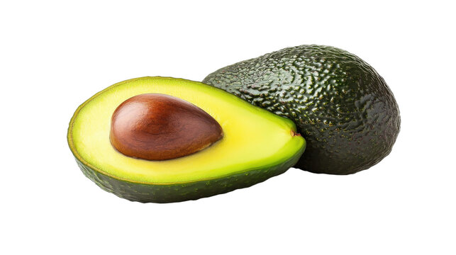 A green avocado with a brown seed in the middle
