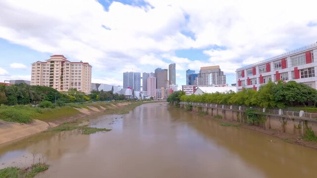 Phnom Penh Cambodia buildings skyline timelapse view from Koh Pich island Tonle Bassac River